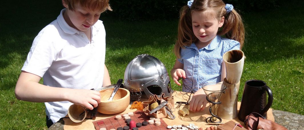 Children playing with Viking tools